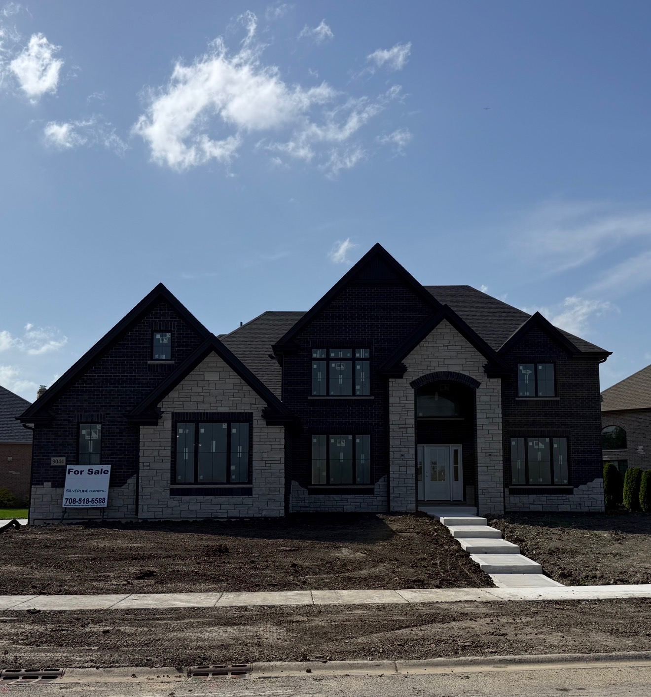 9044 Port Washington Dr, Frankfort — front exterior of the two-story brick and stone home nearing completion