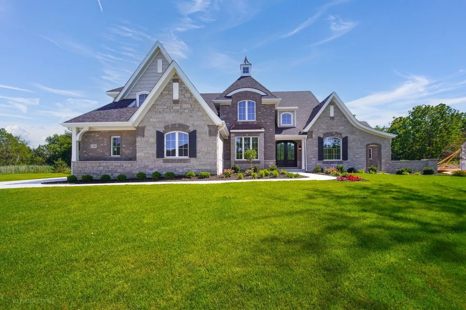 A Silverline Builders home in New Lenox, IL with a stone and brick facade
